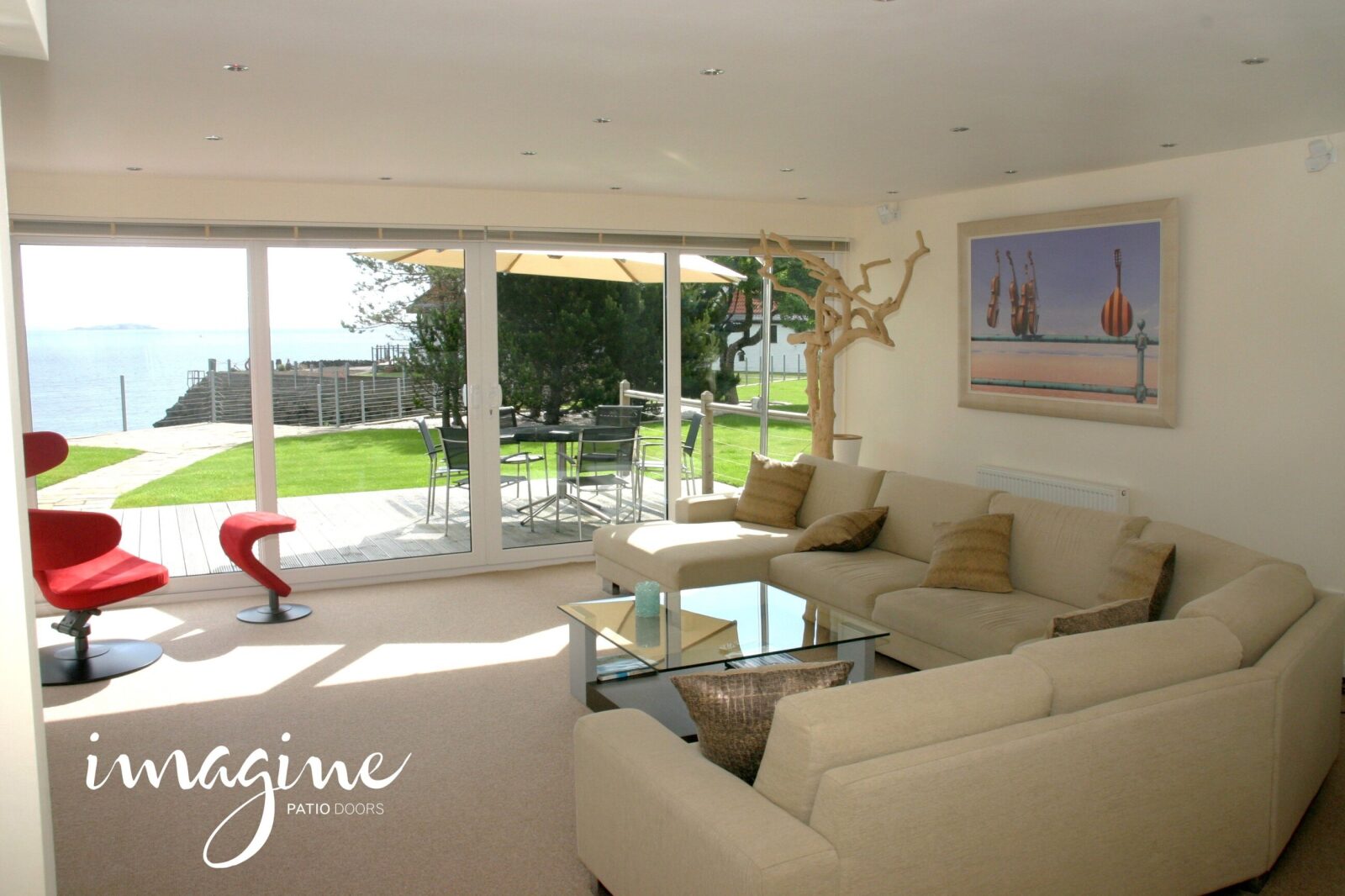 White VEKA Imagine sliding patio doors opening from a lounge onto a garden